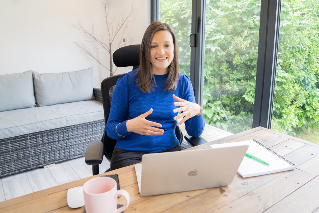 Kate wall, registered nutritionist, at her desk delivering nutritionist support.