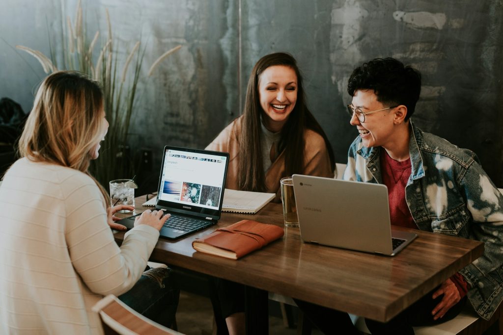 people enjoying their work around a desk